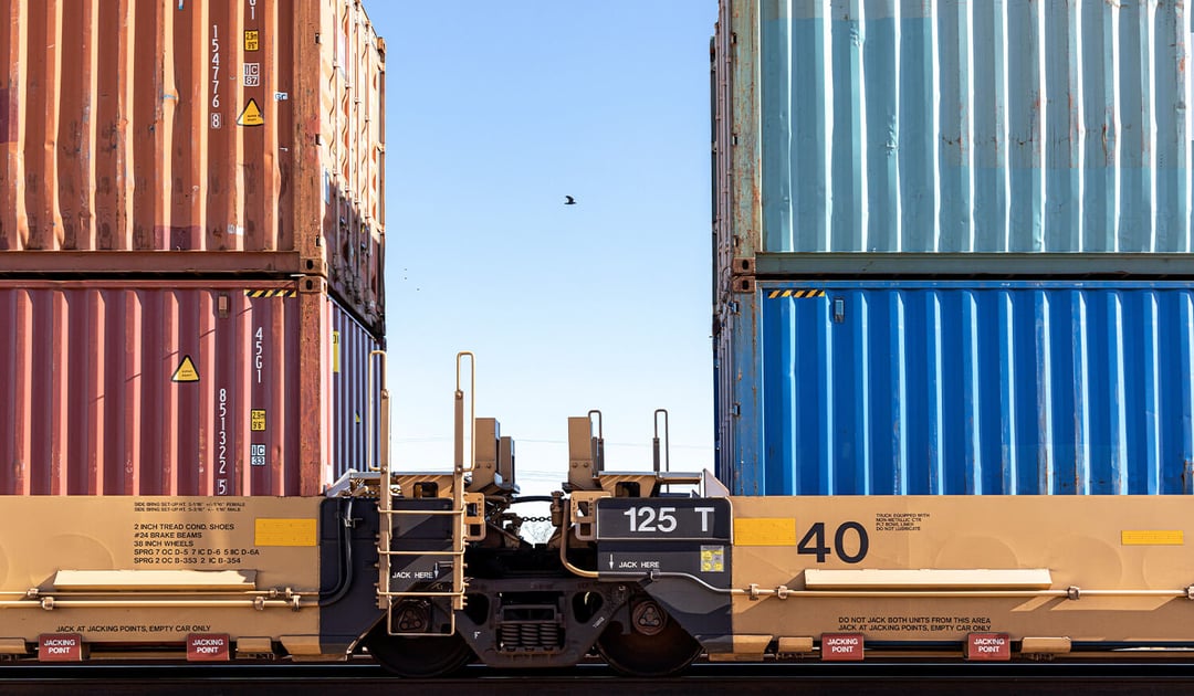 Close Up of Double Stack Containers on Train with Bird in Background
